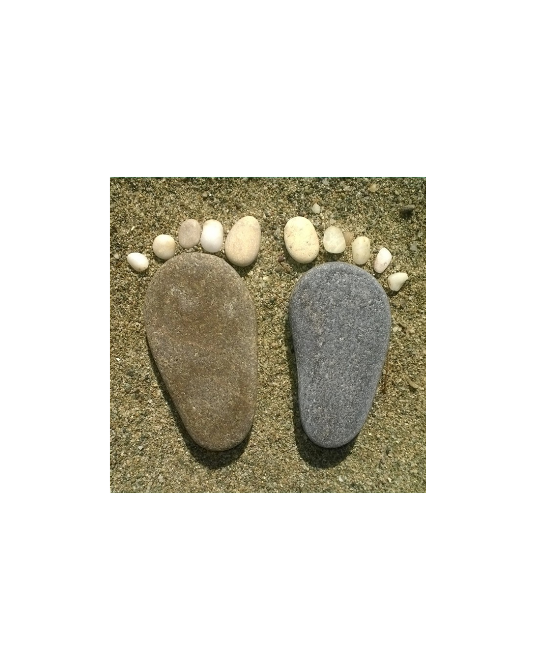 Stone artwork in the shape of two human feet used as a logo for Pedicure Expert.