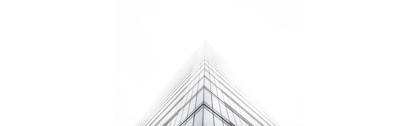 Futuristic glass tower disappearing into white sky — symbolizing online and offline business infinity